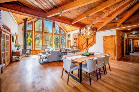 Living and dining area with cathedral ceiling plus mountain and river views!