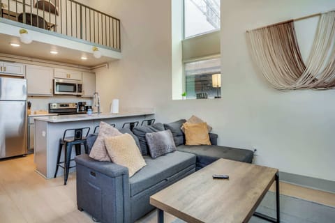 Living Room: Make yourself at home in the cozy living room with a comfy sofa and TV to unwind.