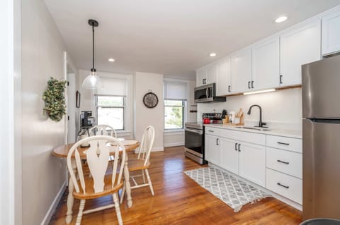 Step into Apartment B’s sunny kitchen, boasting plenty of space & amenities