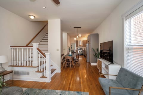 Cozy and spacious living area with TV