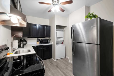 The sleek kitchen offers loads of storage space & every home comfort