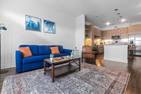 The living room’s cozy vibe makes it the perfect spot to relax, with ample seating and a warm ambiance.