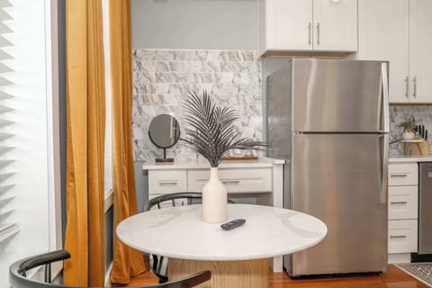 Enjoy meals together at the cozy dining table, offering seating for 2