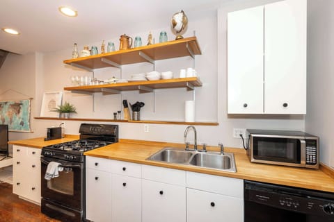 The chic eat-in kitchen offers ample space & all the comforts of home