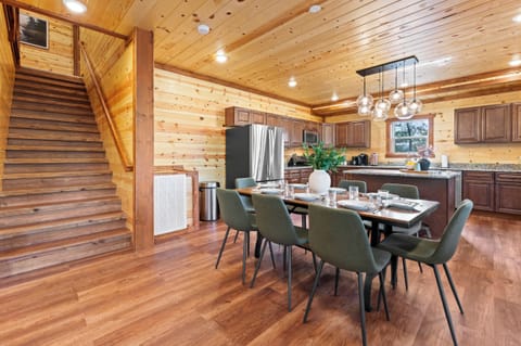 Fully equipped chef’s kitchen with granite countertops and bar seating.