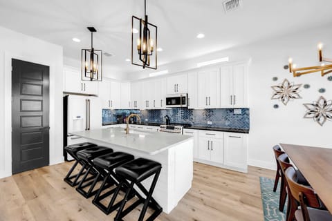 This stunning and sleek kitchen is stocked with your cookware essentials
