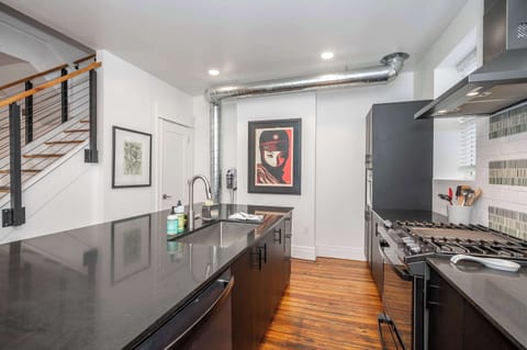 The sophisticated kitchen offers ample space & all the comforts of home