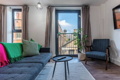 Bright top-floor living space with comfy seating, a Smart TV with Netflix, and a sofa bed for extra guests — the perfect spot to relax after exploring the city