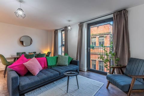 Bright top-floor living space with comfy seating, a Smart TV with Netflix, and a sofa bed for extra guests — the perfect spot to relax after exploring the city