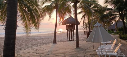 On the beach, sun loungers, beach towels