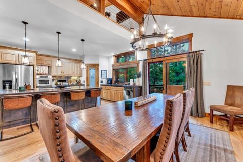 Dining Room: 10-person dining table, open layout to kitchen and living room