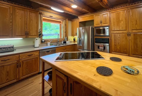 Kitchen: Well-equipped kitchen, updated appliances, kitchen island with 2 barstools, ample cabinet and counter space