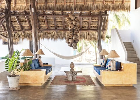 Living area with a coconut chandelier.