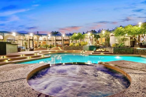 A private resort with all the amenities all to yourself! This expansive 1.5 acre estate comes with a massive heated pool , spa, mini golf, full court basketball, tennis court, and large game room. The perfect retreat for endless fun for your group!