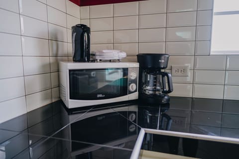 Fridge, microwave, stovetop, coffee/tea maker