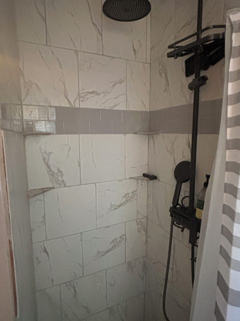 Shower, jetted tub, towels, soap