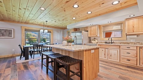 This spacious kitchen with natural wood finishes is perfect for family meals!