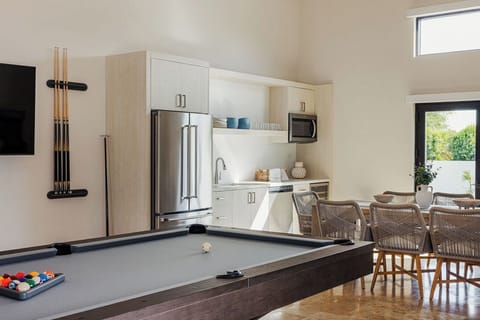 Your own game room equipped with a pool table & arcade games for some friendly competition. You'll also have use of a spin bike to stay active, a large living room and kitchenette!