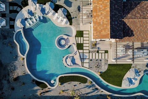 Outdoor paradise featuring an expansive lazy river that winds across the entire property.