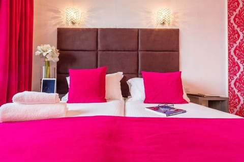 Get a peaceful night sleep in our cozy bedroom, which features 2 Single beds which can be configured into a Double bed.