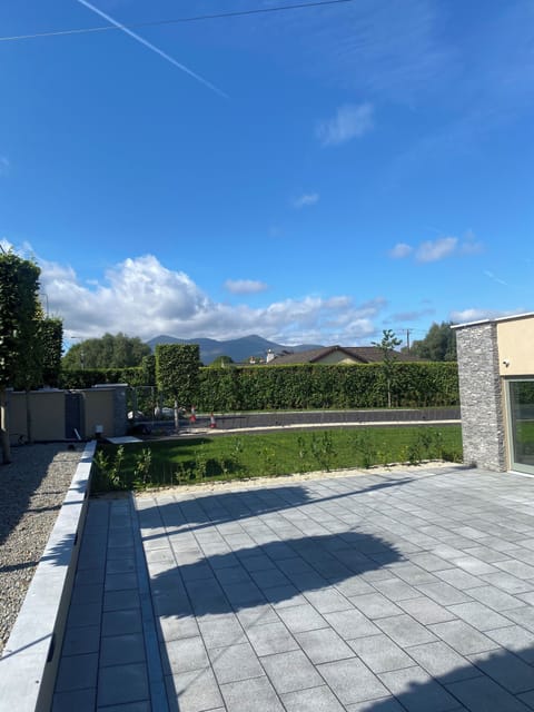 Large patio space , secure parking & garden with electric gate . EV charger