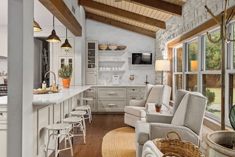 A separate bar seating area invites conversation while meals are being prepared.