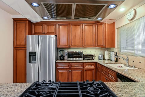 Kitchen with toaster, drip coffee maker, blender, and more