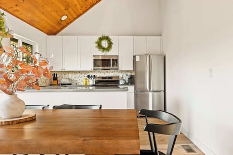 Gather for meals together at the dining table, with seating for the whole family