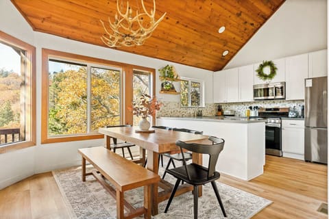 Gather for meals together at the dining table, with seating for the whole family