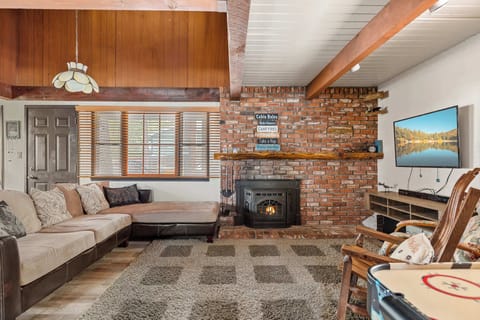 Cozy and spacious living area with TV