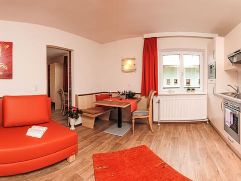 Table, Furniture, Property, Couch, Picture Frame, Comfort, Cabinetry, Orange, Wood, Building