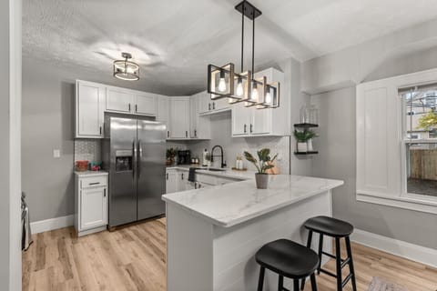 Elevate your stay with a beautifully crafted kitchen and bar counter, perfect for creating and enjoying your favorite drinks and meals.