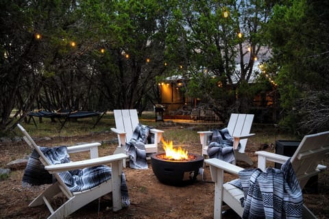 Cozy up by the fire pit—perfect for s'mores, stargazing, and making memories.