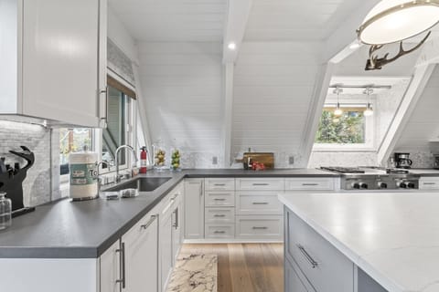 Bright, modern kitchen with sleek countertops and ample cabinet space.