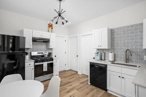 Kitchen: Modern design with sleek appliances and stylish accents, ready for culinary adventures!