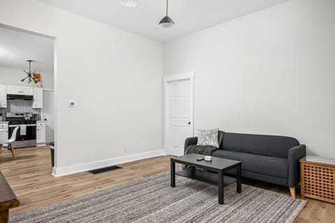 Living Room: Bright and inviting space with stylish furnishings, perfect for relaxed gatherings!