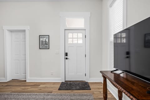 Entryway: Embrace modern charm with vibrant Indianapolis art and welcoming natural light!