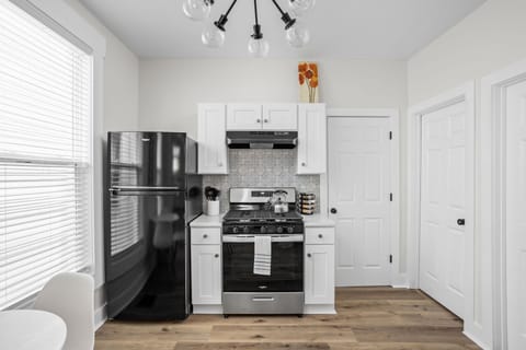 Kitchen: Stylish space with modern appliances and unique decor for delicious culinary adventures!