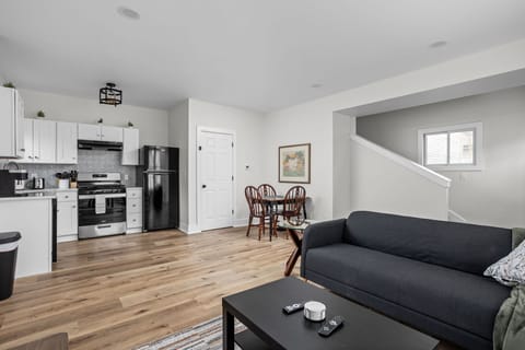 Open Concept Living: Relax in stylish comfort with a bright kitchen, dining area, and cozy seating!