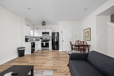Living Room & Kitchen: Bright and airy space with modern appliances, perfect for meals and memories!