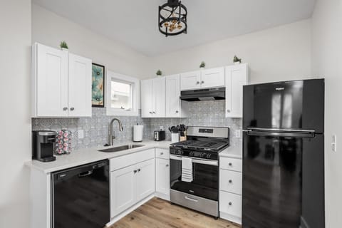Kitchen: Whip up culinary delights in this sleek space with modern appliances and vibrant decor!