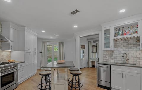 Fridge, stovetop, dishwasher, coffee/tea maker