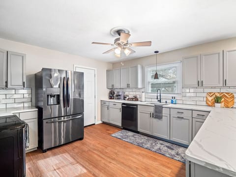 A bright and airy kitchen, perfect for cozy mornings and delicious dinners.  Sunshine streams in, illuminating the gleaming stainless steel appliances. ✨ #dreamkitchen