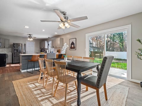 The perfect spot for a delicious meal, surrounded by loved ones.  The warm colors and natural light create a comforting ambiance.