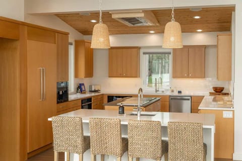 Seating space at the kitchen to share conversation while you cook.