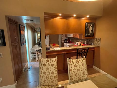 View of kitchen and pass through from living room
