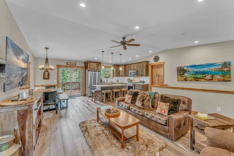 Living Room: 3-cushion couch, 1 recliner, 65” Smart TV w/DVD player, wood-burning fireplace