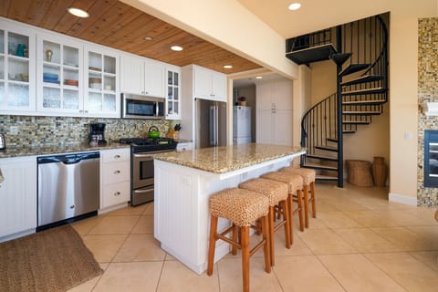 The kitchen is open and offers an island for ample prep space