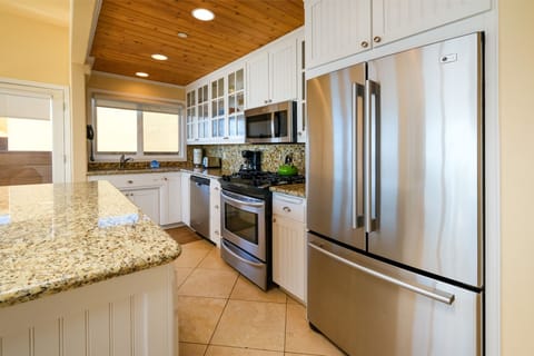 The kitchen is well appointed with high end appliances