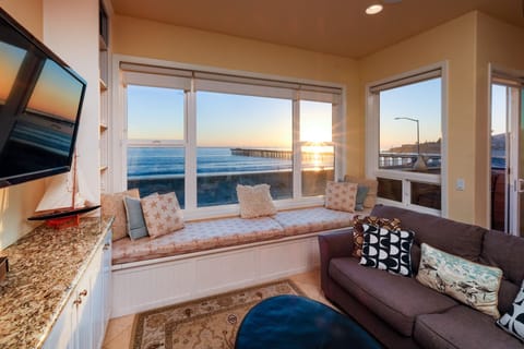 Living room features a window alcove and comfy seating, soak in the views